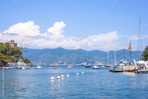 Daylight view to ships cruising on water near Portofino city in Italy © frimufilms