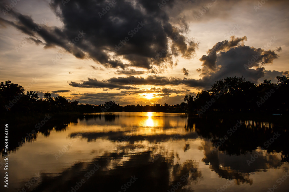 Landscape sunset  over lake in park.