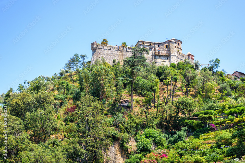 Daylight view to a castle on top of mountains near Portofino, Italy