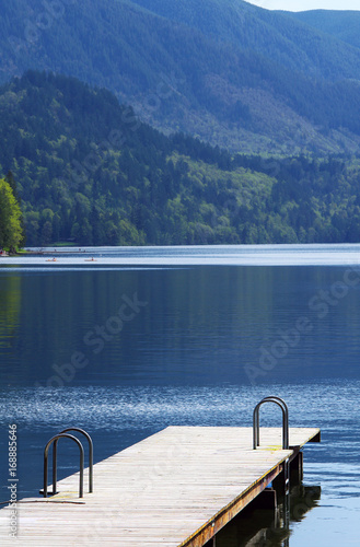 Dock with mountains and calm water