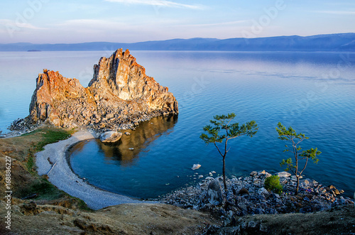 Summer sunset over Rock of Shamanka Burhan on Olkhon Island in Lake Baikal, Russia