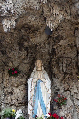 Holy Mary statue in chapel with the appearance of a grotto