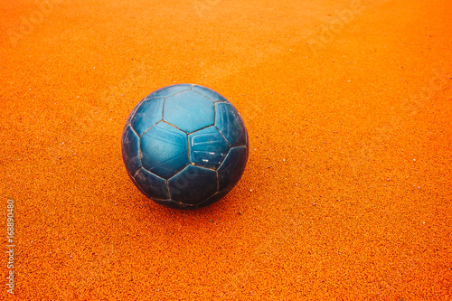 beautiful blue soccer ball on orange ground