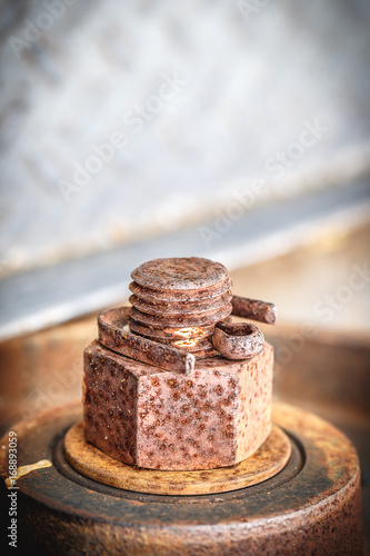 Old rusted nut close up background.