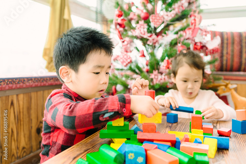 Kid playing blocks on Christmas photo