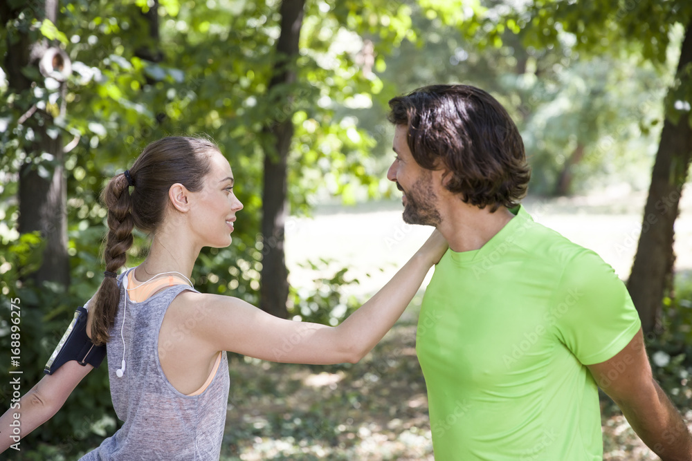 Young couple having exercise in the park Young couple having exercise in the park
