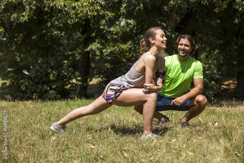Young couple having exercise in the park