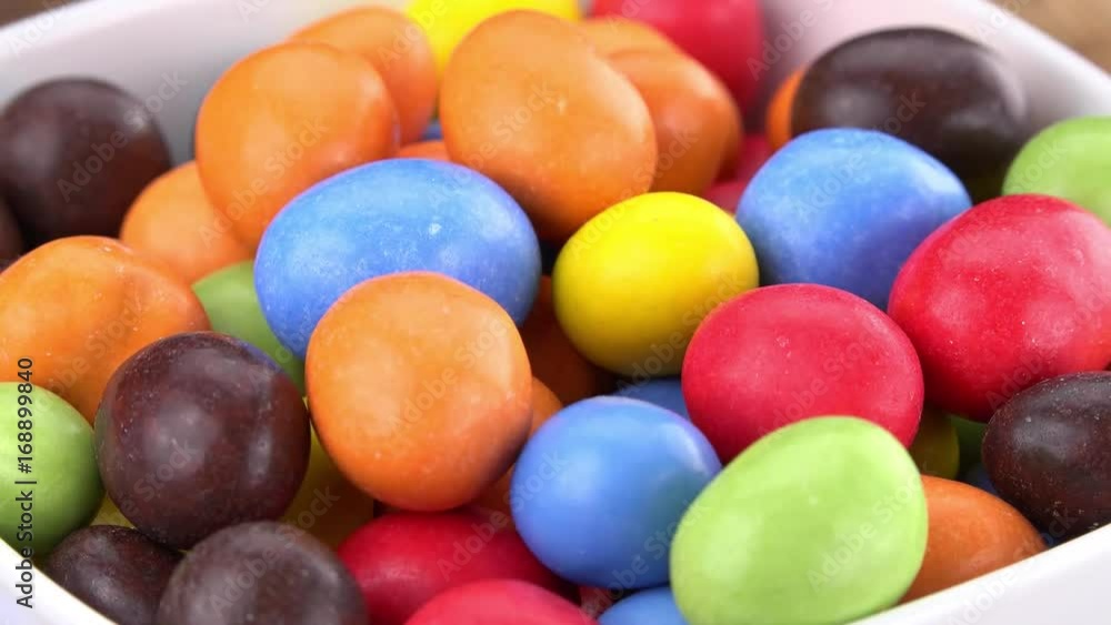 Chocolate Covered Peanuts on a rotating wooden plate (seamless loopable; 4K) Chocolate Covered Peanuts on a rotating wooden plate (seamless loopable; 4K)