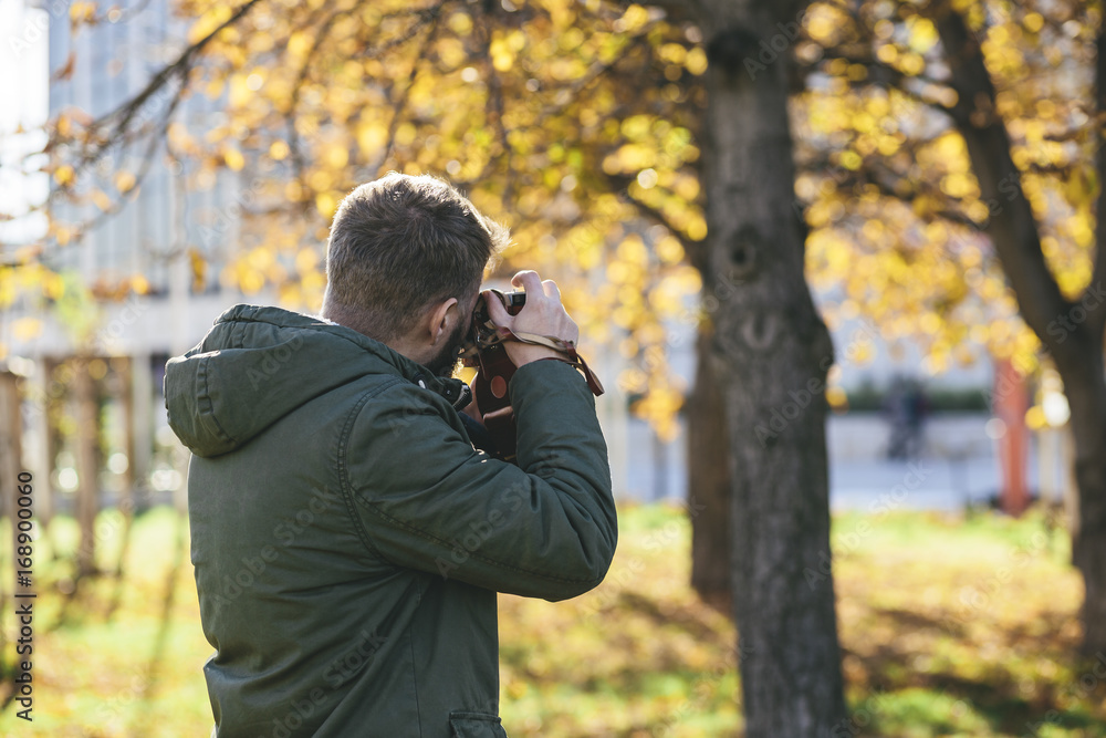 Man taking pictures with old camera Man taking pictures with old camera