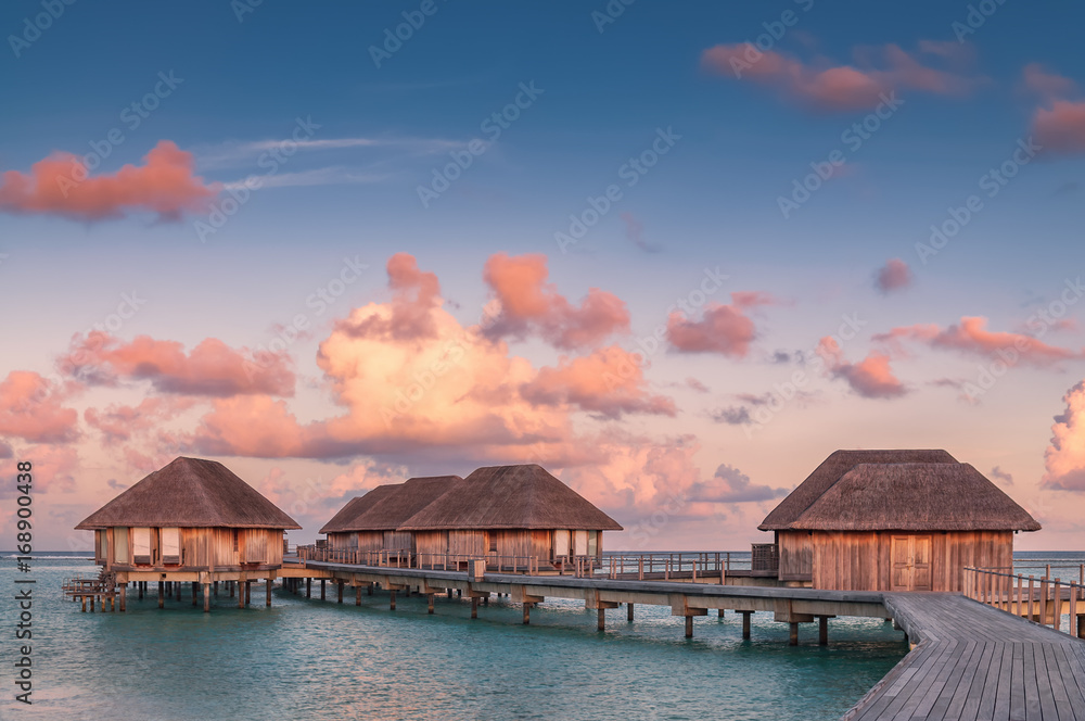 Wonderful golden hour at tropical beach resort in Maldives