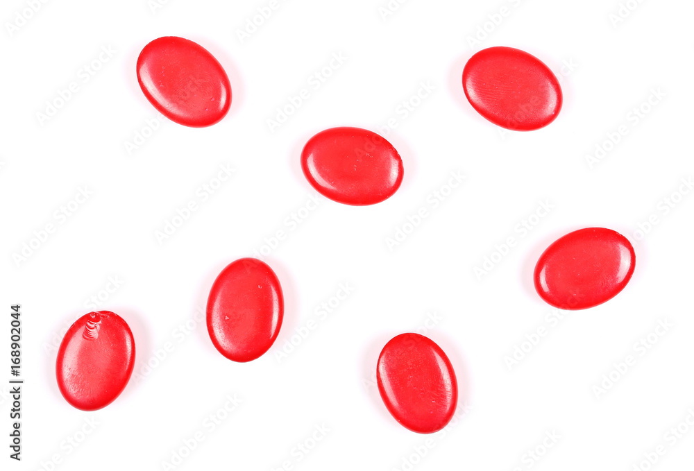 Red candies isolated on white background, top view Red candies isolated on white background, top view
