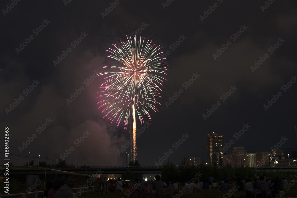 Toyohira River Fireworks, this festival is regarded as Hokkaido most popular fireworks festival over 4000 fireworks light up the night sky over Sapporo, Japan. Image show noise due night shot. Toyohira River Fireworks, this festival is regarded as Hokkaido most popular fireworks festival over 4000 fireworks light up the night sky over Sapporo, Japan. Image show noise due night shot.