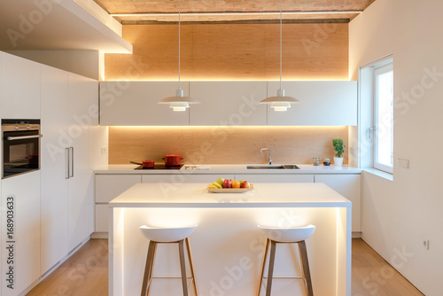 Interior of light kitchen photo