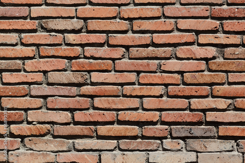 Ancient wall and sunlight. Cement and thin bricks Ancient wall and sunlight. Cement and thin bricks