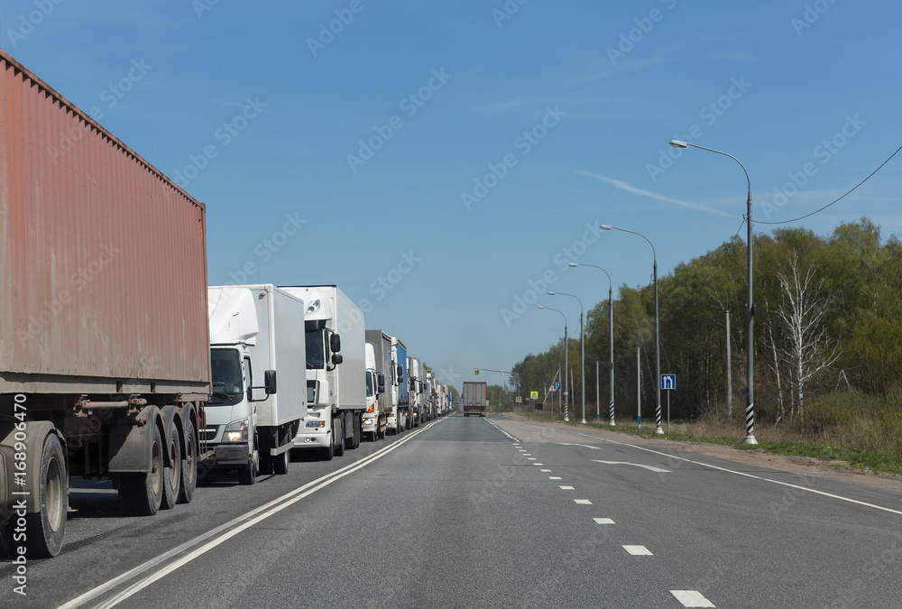 Lorry trucks row in traffic jam on highway