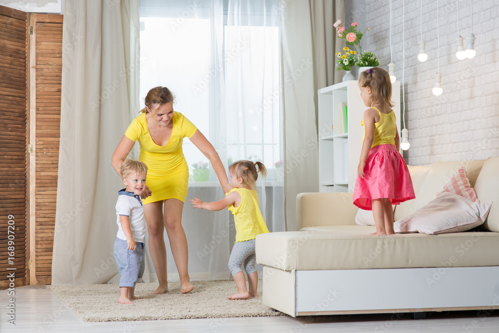 Obraz premium Mom and children twins playing