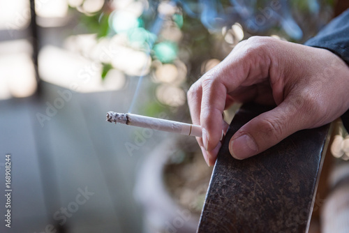 a man smokeing tabacco or cigarette. smoke tabacco and cigarette bad Health