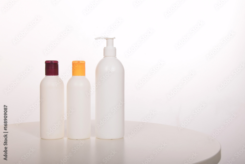 Cosmetics in bottles of plastic containers and tubes Cosmetics in bottles of plastic containers and tubes