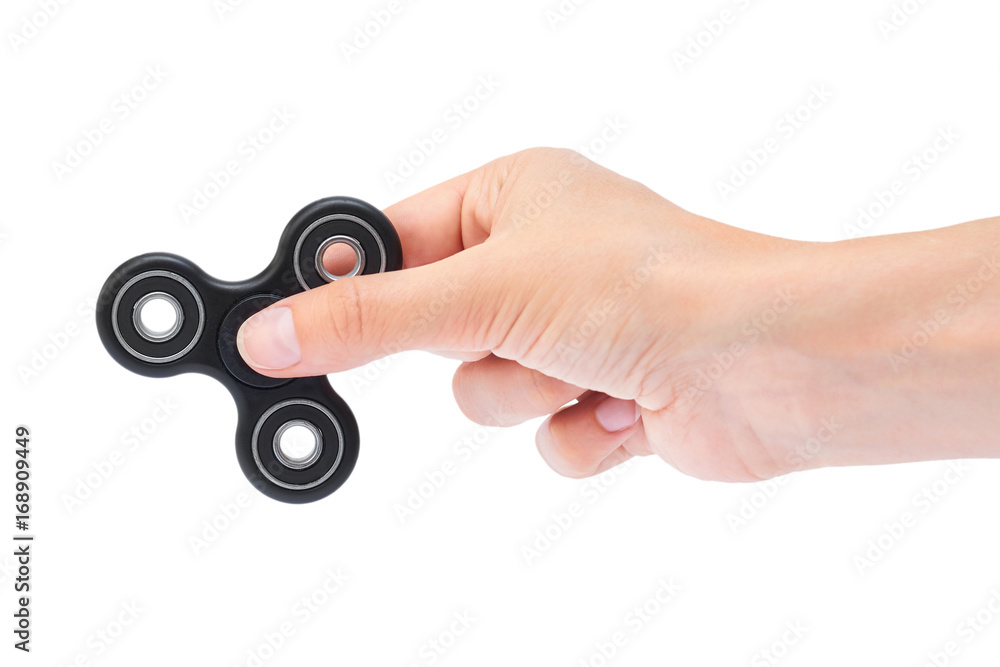 Hand holding Black Fidget Spinner isolated on white background Hand holding Black Fidget Spinner isolated on white background