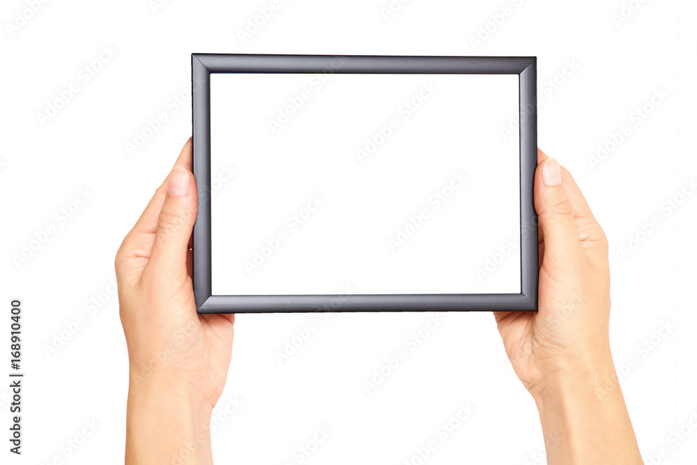 Decorative black photo frame in hand isolated on white background Decorative black photo frame in hand isolated on white background
