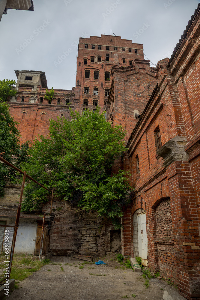 Old abandoned red brick grain elevator Old abandoned red brick grain elevator