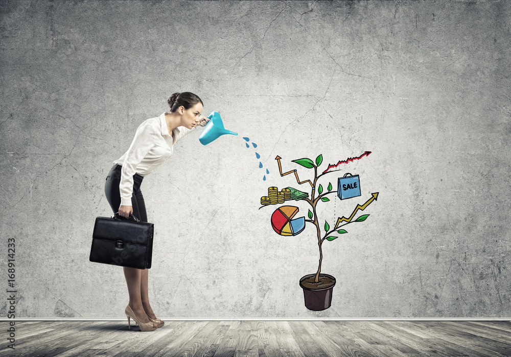 Young businesswoman in empty room watering drawn growth concept with can Young businesswoman in empty room watering drawn growth concept with can