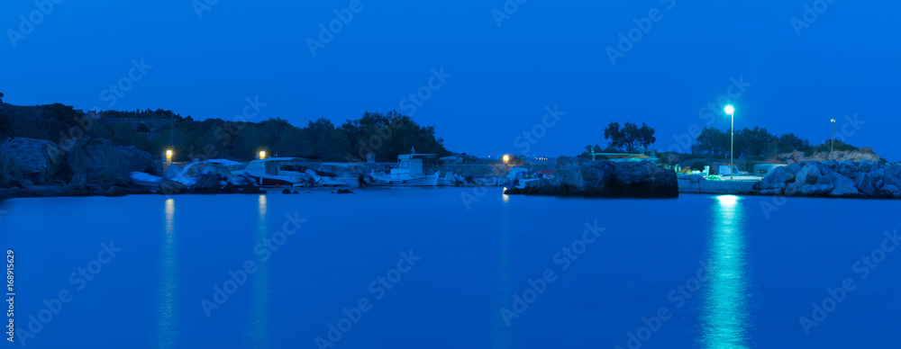 Pigaki port in Paros island in Greece during the blue hour.
