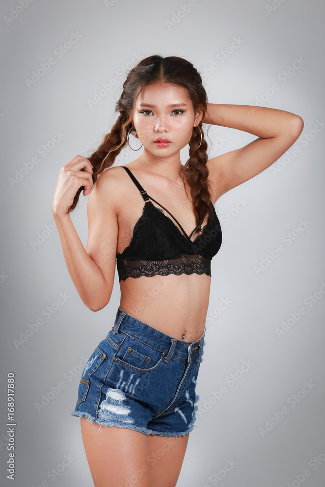 Woman wearing black bra lingerie and shorts jeans Stock Photo