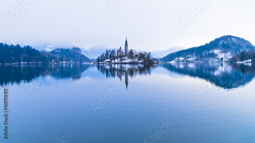 Perfect symetry of a lake and church on a small island, Bled, slovenian alps, Slovenia