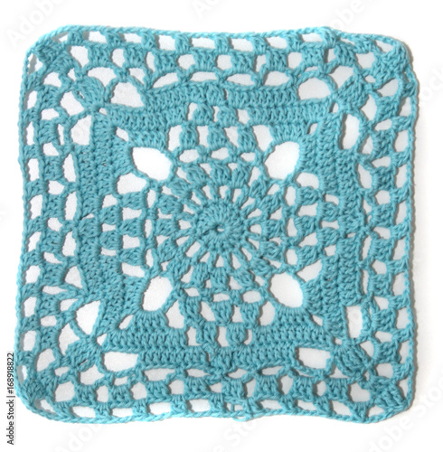 blue crochet square on white background
