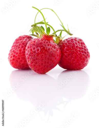 Fototapeta Naklejka Na Ścianę i Meble -  Three red strawberries.