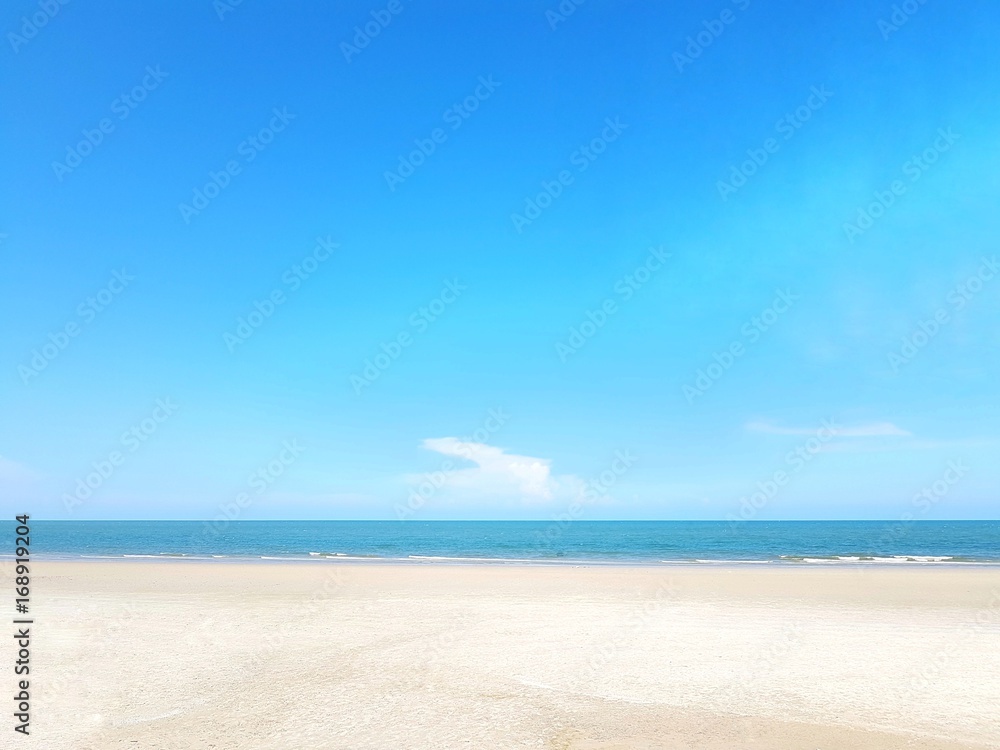 Empty sea and beach on blue sky background