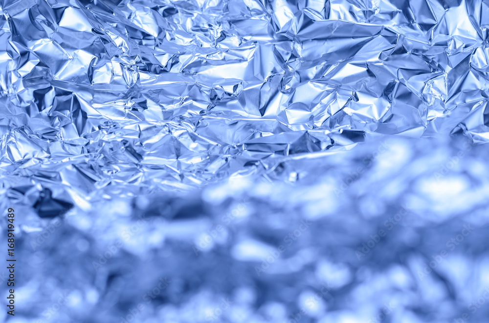 abstract wrinkled aluminum foil background, crispy mountain look, shallow depth of field abstract wrinkled aluminum foil background, crispy mountain look, shallow depth of field