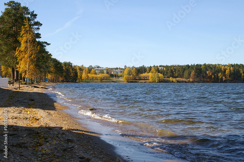 View of the beach, the shore of lake Sinara and Lenin street, Snezhinsk, Chelyabinsk region, Russian Federation photo