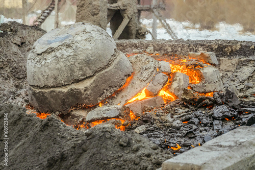 Molten incandescent hot slag in slag dump. Wastes from the metallurgical industry. photo