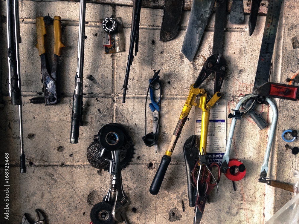 Many Tools on dirty floor, Set Craftsman tool , mechanical tools.  Professional mechanic using different tools for working in auto repair  service. auto mechanic tools wrench. Stock Photo