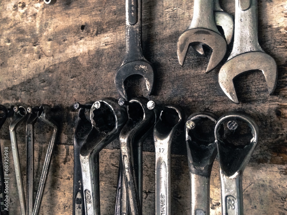 Many Tools on dirty floor, Set Craftsman tool , mechanical tools.  Professional mechanic using different tools for working in auto repair  service. auto mechanic tools wrench. Photos | Adobe Stock