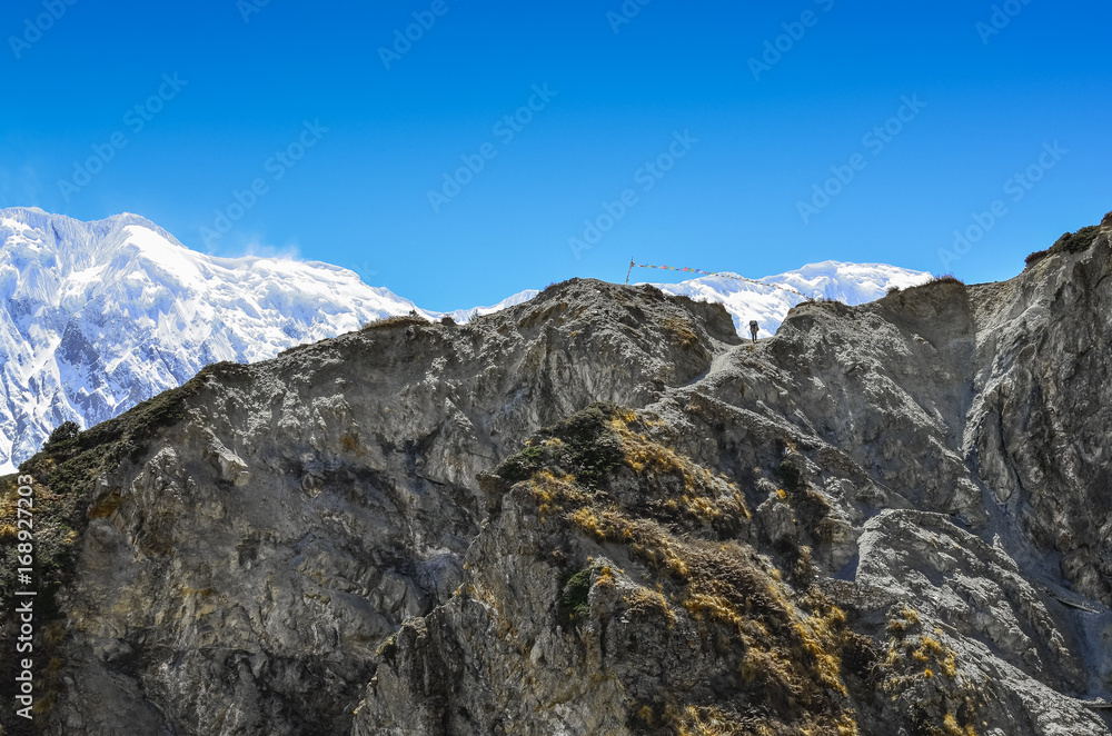 Silhouette of mountain trekker in Himalayas rocky mountains