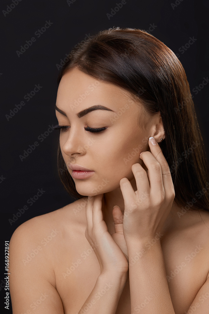 Eyelashes extensions. Fake Eyelashes. Closeup Of Beautiful Young Female Model With Soft Smooth Skin And Professional Facial Makeup. Portrait Of Sexy Girl With Long Fake Eyelashes And Perfect Make-up. Eyelashes extensions. Fake Eyelashes. Closeup Of Beautiful Young Female Model With Soft Smooth Skin And Professional Facial Makeup. Portrait Of Sexy Girl With Long Fake Eyelashes And Perfect Make-up.