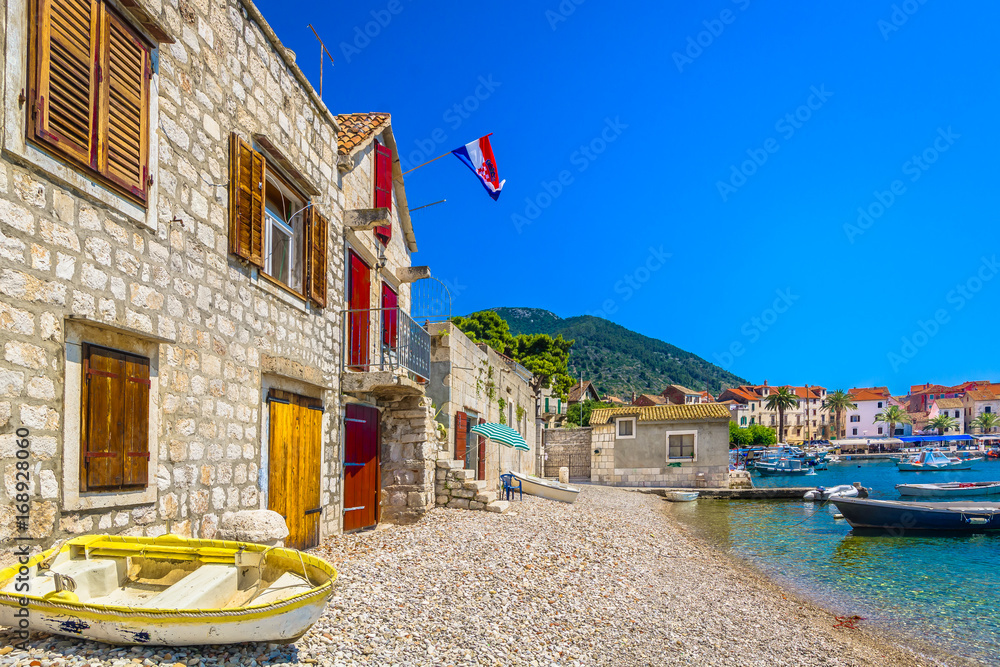 Obraz premium Vis Komiza mediterranean scenery. / Scenic mediterranean view at Komiza on Island Vis, popular summer destination in Croatia, Europe.