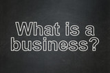Business concept: What is a Business? on chalkboard background