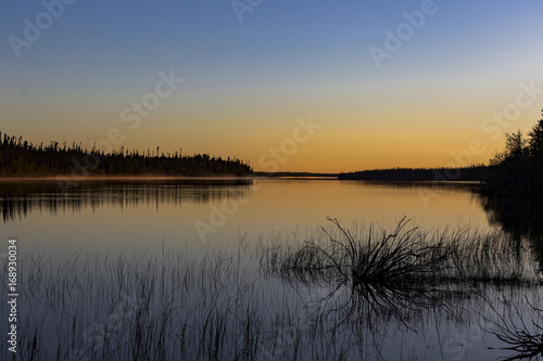 Fototapeta Naklejka Na Ścianę i Meble -  Sunset on the Winisk River in Northern Ontario. The Winisk flows through Ontario's ring of fire before emptying into Hudson's Bay. 
