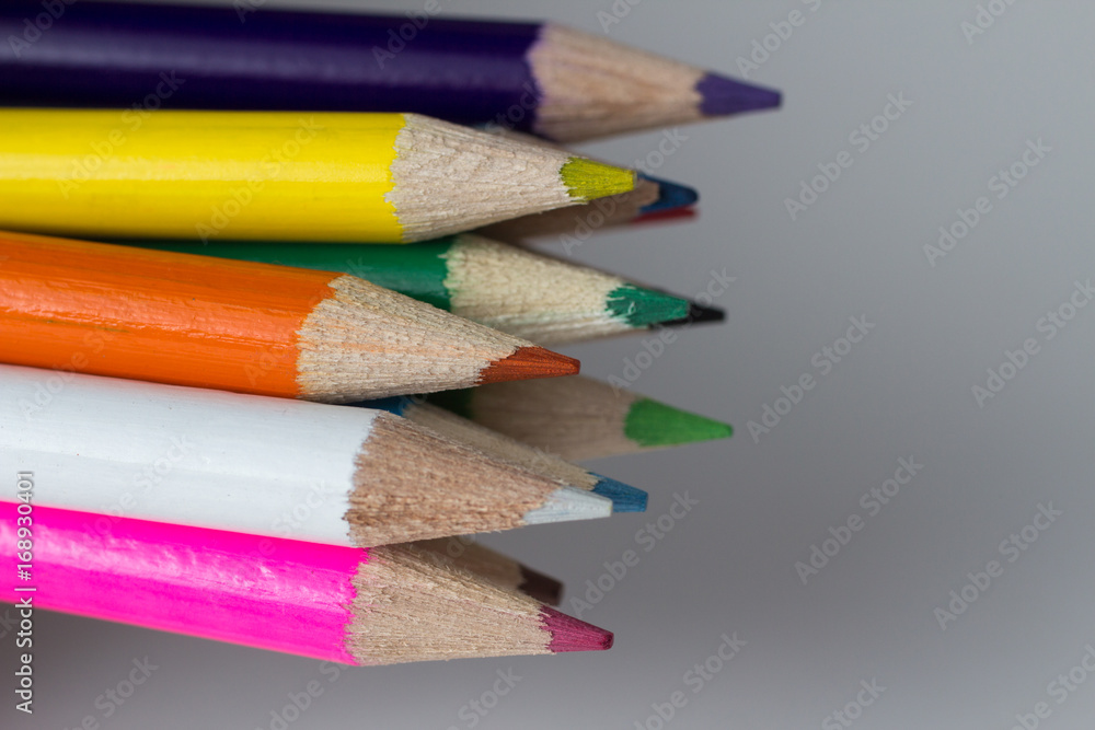 Close-up of a group of multicolored pencils on a white background Close-up of a group of multicolored pencils on a white background