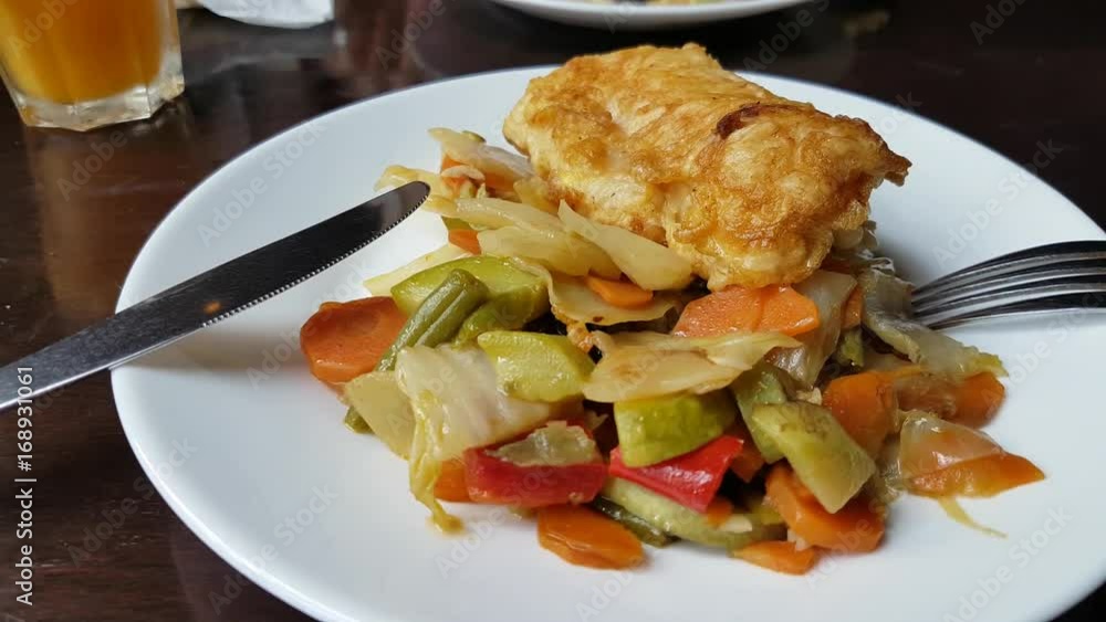 Baked fish with vegetables in restaurant Baked fish with vegetables in restaurant