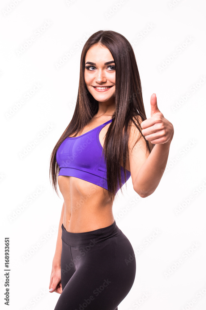 Happy fitness Young Woman Showing Thumbs Up on white background Happy fitness Young Woman Showing Thumbs Up on white background