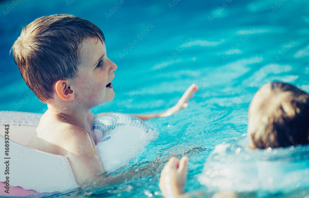 Picture of little kids enjoying in swimming pool Picture of little kids enjoying in swimming pool