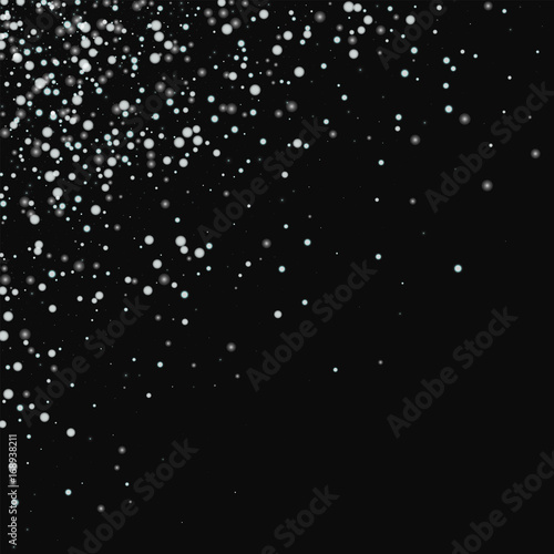 Amazing falling snow. Scattered top left corner with amazing falling snow on black background. Vector illustration. © Begin Again