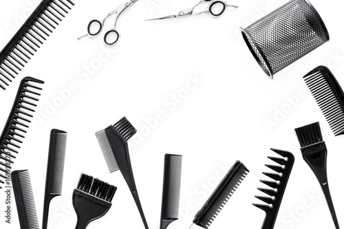 hairdresser work desk with tools for hair styling on white background top view space for text