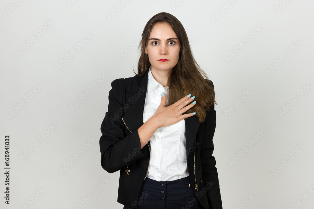 Young businesswoman making an oath with hand on heart and chest Young businesswoman making an oath with hand on heart and chest