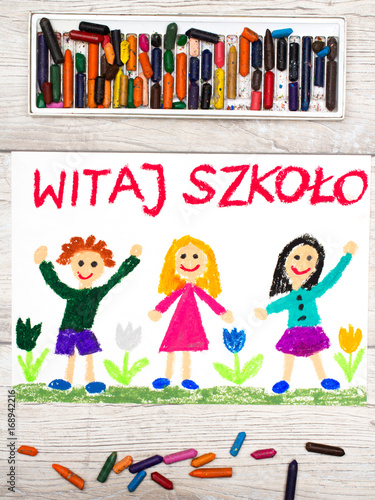 Photo of colorful drawing: Polish word WELCOME TO SCHOOL, school building and happy children. First day at school.